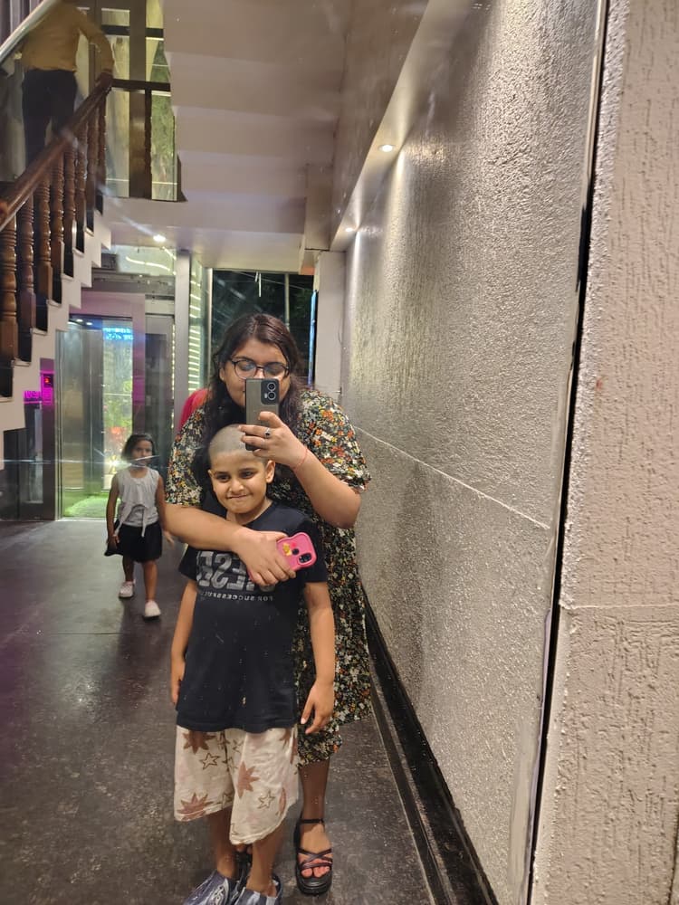 Vyom in a sweet affectionate mirror hug with family